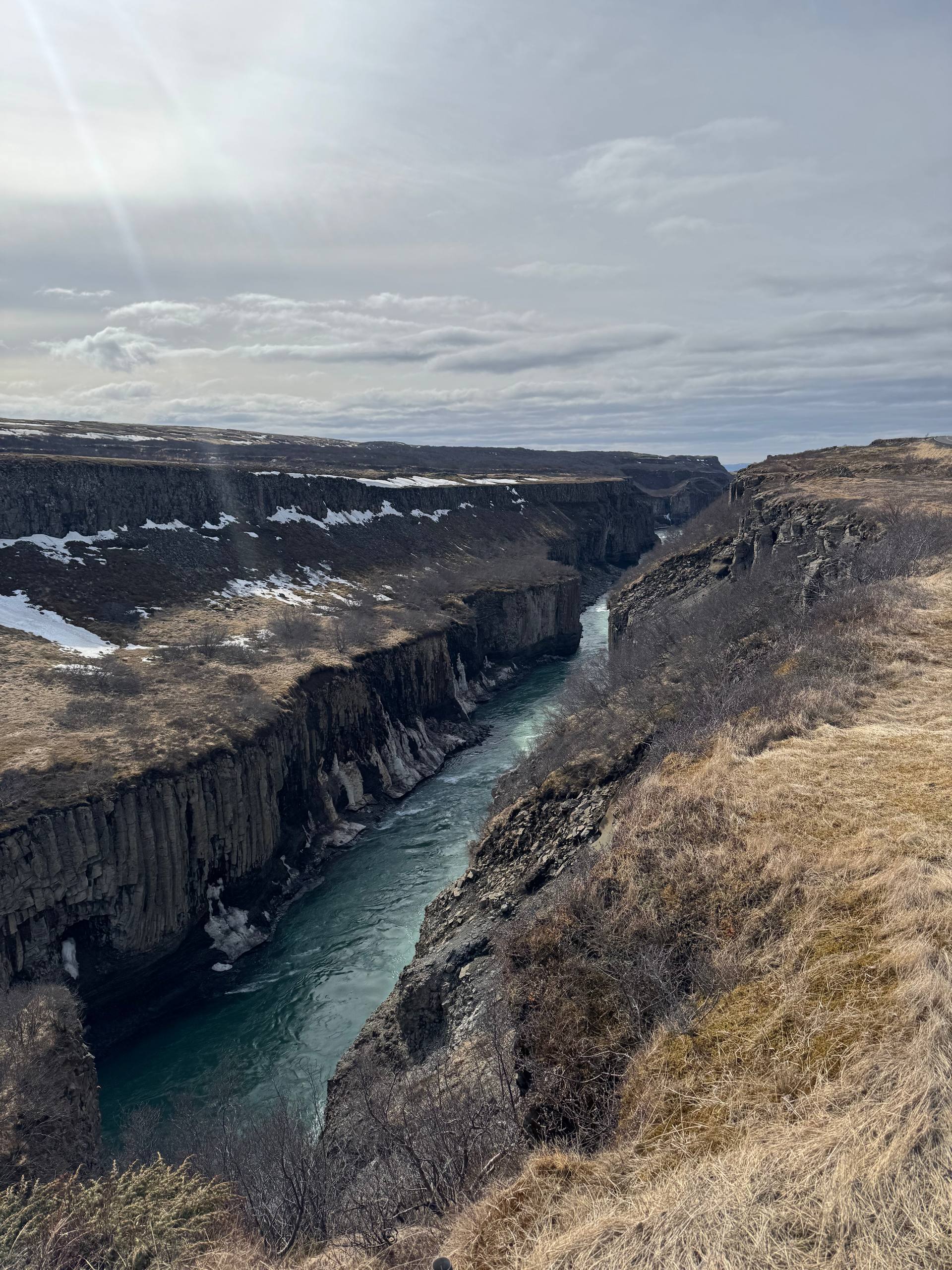 Hvítá River flowing through a dramatic canyon with basalt cliffs and Icelandic landscape during a Day Trips From Reykjavik tour with our agency