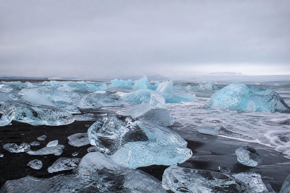 Blocks of glacier ice on the black sand of Diamond Beach beside Jokulsarlon in Iceland