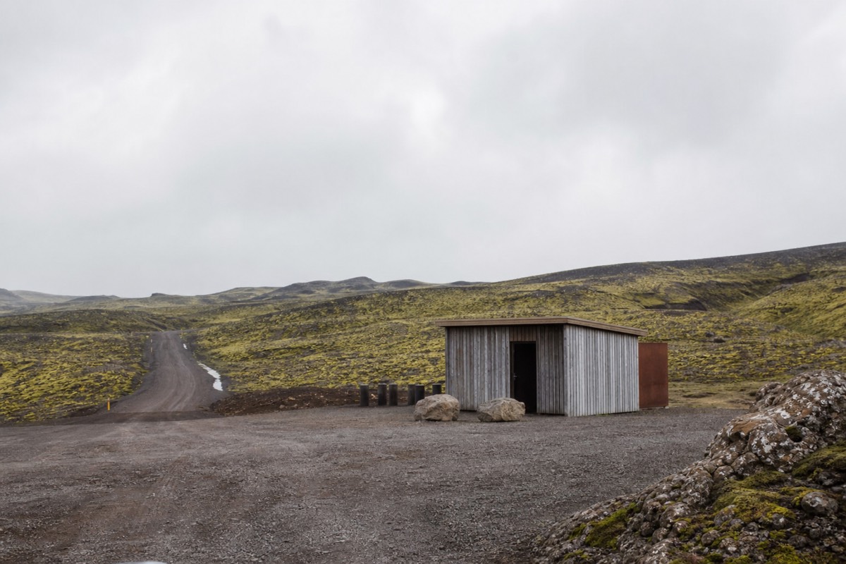 Visitor centre and cafe building at a Golden Circle stop in Iceland with parking and signage